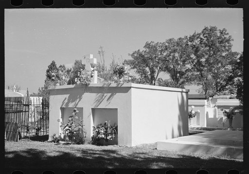 Untitled photo, possibly related to: Decorated graves in cemetery, All Saints' Day, New Roads, Louisiana, with chickens eating the flowers