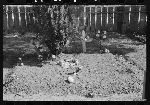 Untitled photo, possibly related to: Decorated graves in cemetery, All Saints' Day, New Roads, Louisiana, with chickens eating the flowers