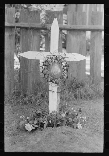 Decorated gravemarker on All Saints' Day, New Roads, Louisiana. Note the beaded ornament, which is made of wire and beads