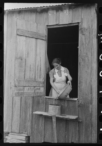 Untitled photo, possibly related to: Wife of FSA (Farm Security Administration) client washing clothes. This family will have advantage of working under tenant purchase plan. Morganza, Louisiana