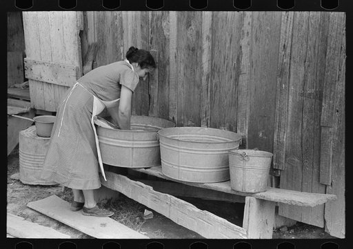 Wife of FSA (Farm Security Administration) client washing clothes. This family will have advantage of working under tenant purchase plan. Morganza, Louisiana