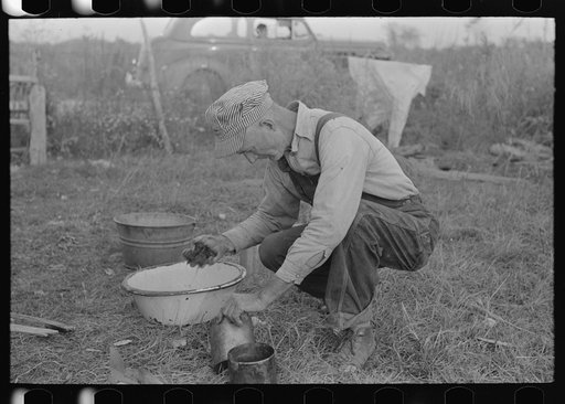 Day laborer working around his shack near New Iberia, Louisiana