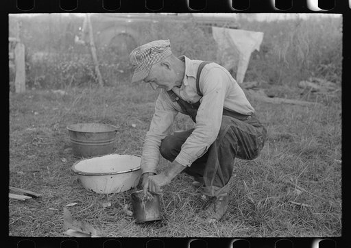 Untitled photo, possibly related to: Day laborer working around his shack near New Iberia, Louisiana