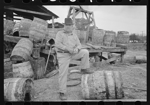 Owner in front of his turpentine still, State Line, Mississippi