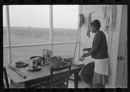 Farmer's wife grinding meat to make sausage, Lakeview Project, Arkansas