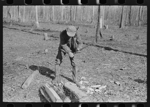 Untitled photo, possibly related to: Farmer of Chicot Farms, Arkansas striking match on button of overalls
