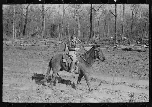 Home supervisor of Chicot Farms project must ride horseback to get to and from project. Arkansas