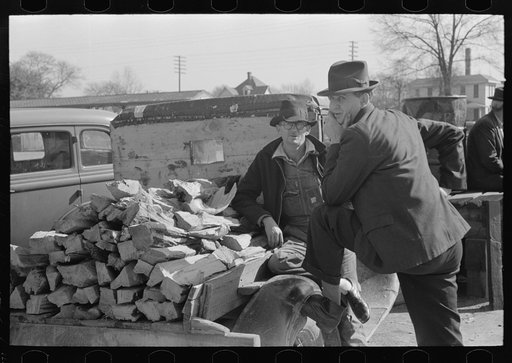 Untitled photo, possibly related to: Man talking to farmer with truckload of wood, Laurel, Mississippi