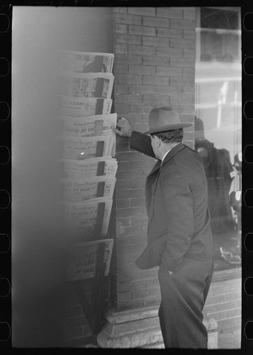Untitled photo, possibly related to: Merchant talking to prospective customer, Laurel, Mississippi