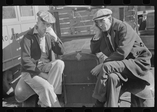 Untitled photo, possibly related to: Farmers sitting on fenders of trucks, Laurel, Mississippi
