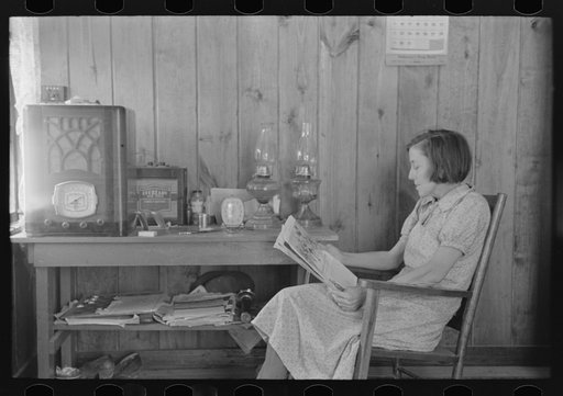 Untitled photo, possibly related to: House wife reading in living room, Chicot Farms, Arkansas