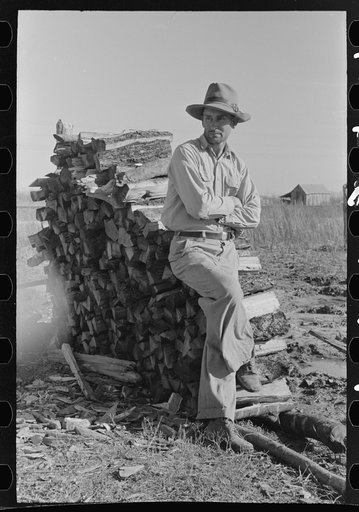 Farmer standing by wood pine, Transylvania Project, Louisiana