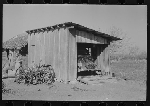 Garage and automobile of small vegetable farmer near Santa Maria, Texas. This farmer said that he found Mexican labor satisfactory. He indicated that the white farmers in this section felt a definite responsibility to the Mexican and saw that he was cared for in bad seasons. He said that two years a