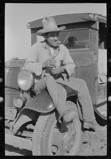 Mexican labor contractor in carrot field near Santa Maria, Texas