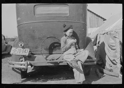 Migrant girl sitting in back of car, Weslaco, Texas