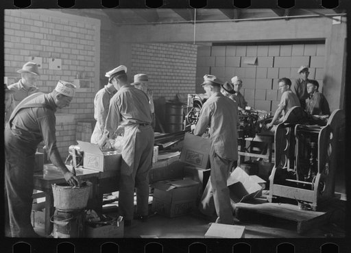 Untitled photo, possibly related to: Conveyor loading direct from cannery into boxcar, Weslaco, Texas