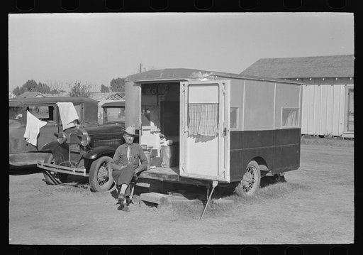 Former cowboy living in trailer home in midst of migrant camp, Weslaco, Texas. He has independent income and travels around the country