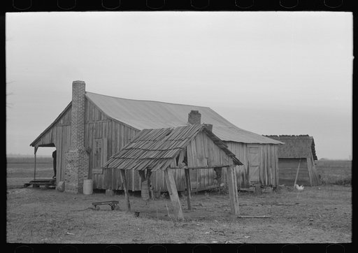 Untitled photo, possibly related to: Back door of sharecropper's house, Pace, Mississippi. Background photo for Sunflower Plantation.