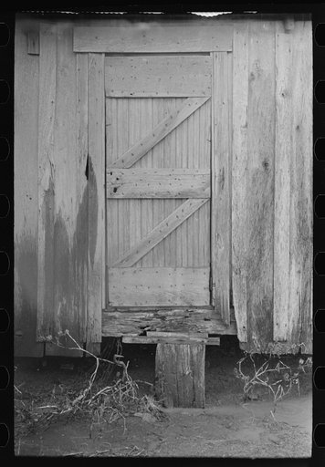 Back door of sharecropper's house, Pace, Mississippi. Background photo for Sunflower Plantation.