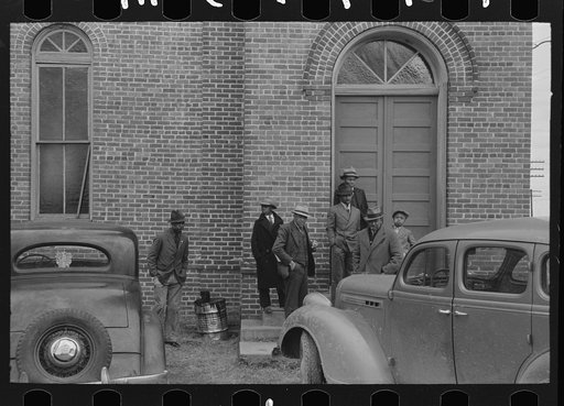 Negroes waiting for church to open, Mound Bayou, Mississippi