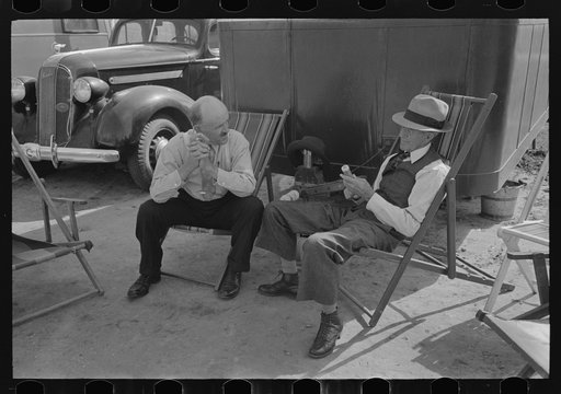 Tourists traveling in trailers talking in camp, McAllen, Texas