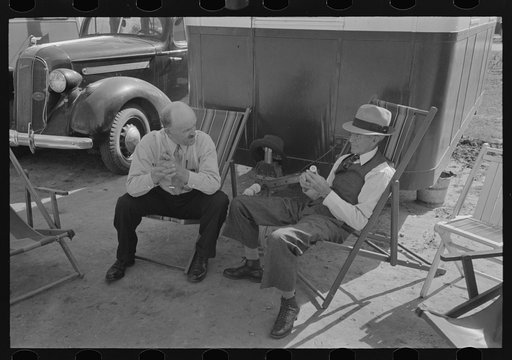Untitled photo, possibly related to: Tourists traveling in trailers talking in camp, McAllen, Texas