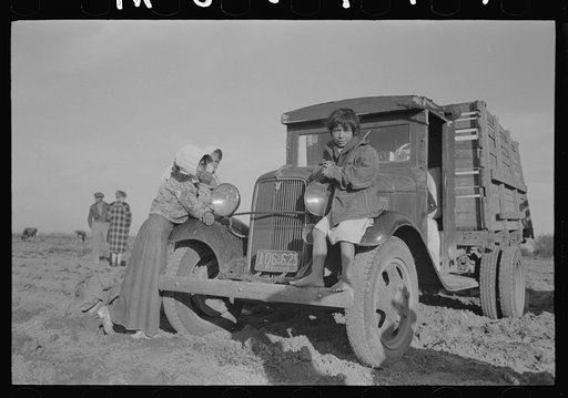 Waiting for work to begin in carrot fields near Santa Maria, Texas