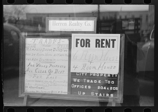 Signs in real estate window, Harlingen, Texas