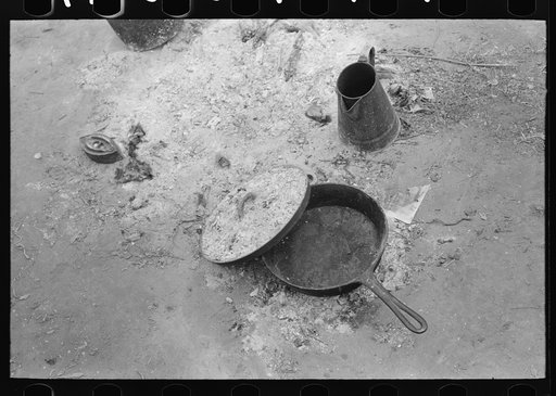 Skillet with skeleton lid and coffee pot in active use by white migrant family from Arizona, near Harlingen, Texas