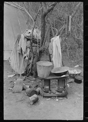 Untitled photo, possibly related to: Outdoor stove, washstand and other household equipment of white migrant family near Harlingen, Texas
