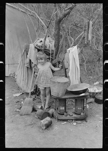 Outdoor stove, washstand and other household equipment of white migrant family near Harlingen, Texas