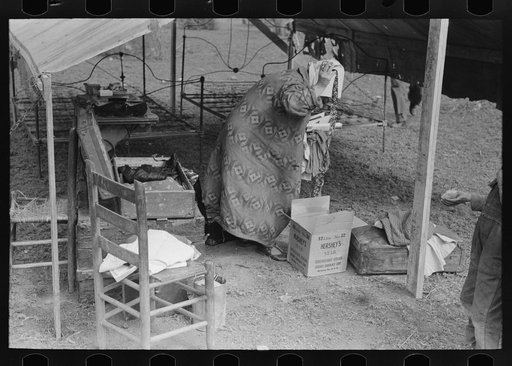 Setting up housekeeping in tent home near Harlingen, Texas