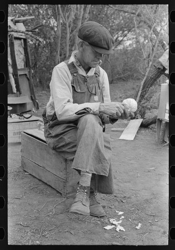 Untitled photo, possibly related to: White migrant worker sawing wood for stakes to be used in setting up tent home, near Harlingen, Texas
