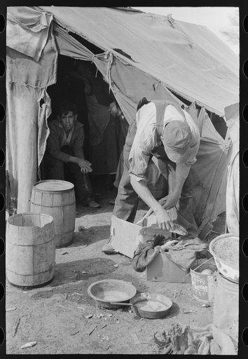 White migrant worker cleaning fish near Mercedes, Texas