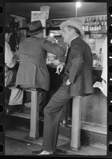 Men sitting at lunch counter, Raymondville, Texas