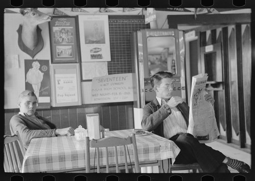 Boys sitting at table in restaurant, Raymondville, Texas
