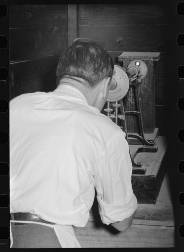 Chemist running test on sweet potato starch, Laurel, Mississippi