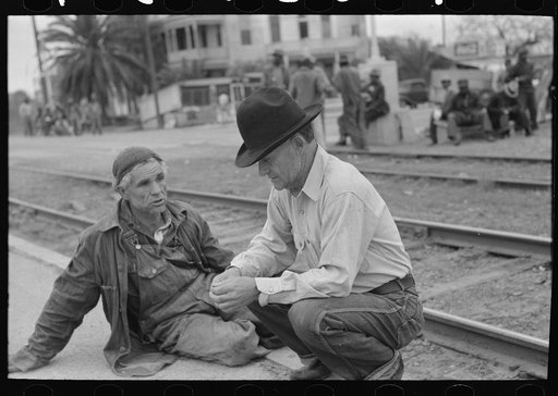 Group of men inspecting secondhand tires for sale, Corpus Christi, Texas