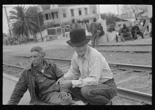 Untitled photo, possibly related to: Group of men inspecting secondhand tires for sale, Corpus Christi, Texas