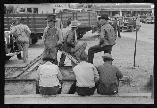 Day laborers waiting for possible assignment to work, early morning, Raymondville, Texas