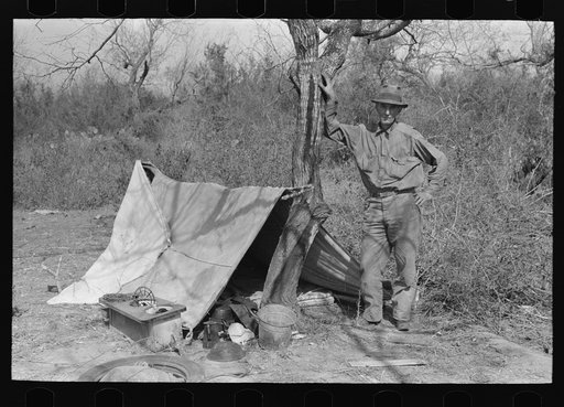 Migrant man encamped in the mesquite north of Harlingen, Texas