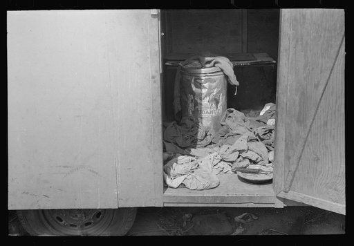 Looking in doorway of trailer of migrant, north of Harlingen, Texas
