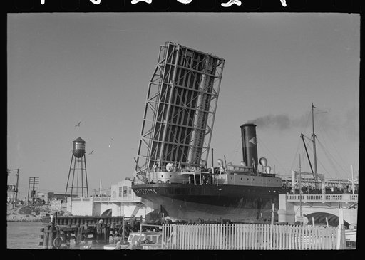 Ship going through drawbridge entering port of Corpus Christi, Texas
