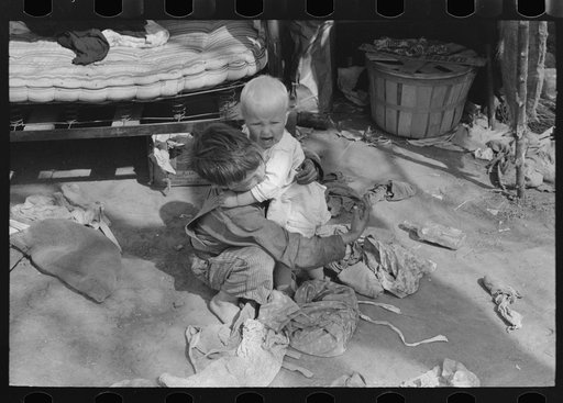 Migrant children playing in front of tent, Harlingen, Texas