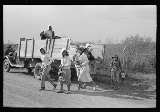 Mexican women leaving truck which brought them to the spinach field, La Pryor, Texas