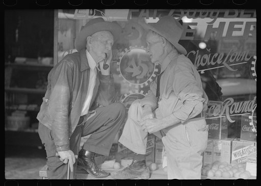 Residents of Crystal City, Texas, talking in front of grocery store