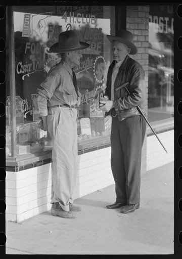 Untitled photo, possibly related to: Residents of Crystal City, Texas, talking in front of grocery store