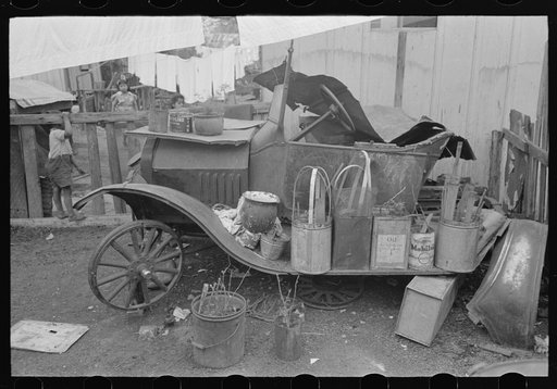Old automobile with various potted flowers, Mexican district, San Antonio, Texas
