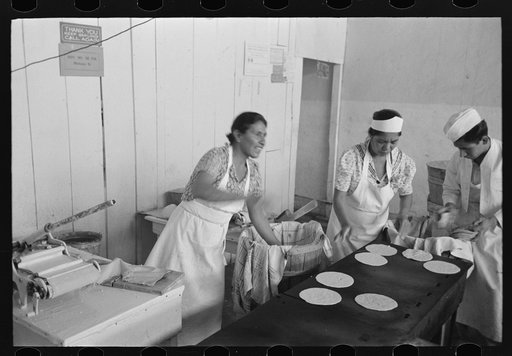 Untitled photo, possibly related to: Making tortillas in bake shop, San Antonio, Texas. Tortillas are made of corn flour which is very finely ground and mashed corn. No moisture or baking powder or salt is added