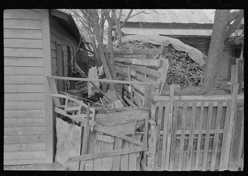 Untitled photo, possibly related to: Alleyway leading to corral in Mexican district, San Antonio, Texas. Ten or more houses are built around the corrals which are used as community yards